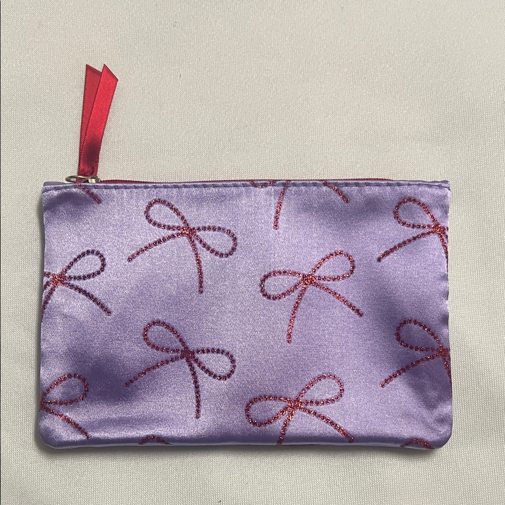purple and red bow makeup bag